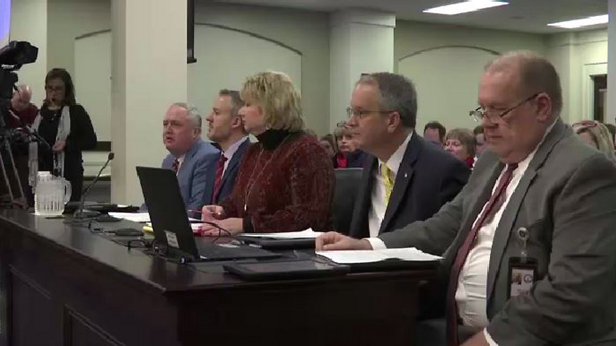 Heads of Kentucky public employee retirement systems at table for public pension group hearing, including heads of the Kentucky Education Association (KEA), Kentucky Retired Teachers Association (KRTA), Kentucky School Boards Association (KSBA), Kentucky Association of School Superintendents (KASS), and the Kentucky Association of School Administrators (KASA)